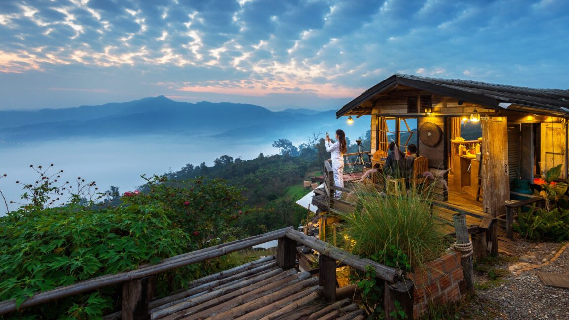 Woman Taking Picture of Beautiful Scenery